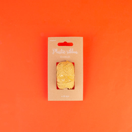 Bobine de ruban à paillettes dorées pour vos décorations de mariage ou de Noël.