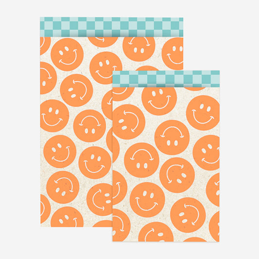 Pochette en papier smiley orange pour faire une pochette surprise
