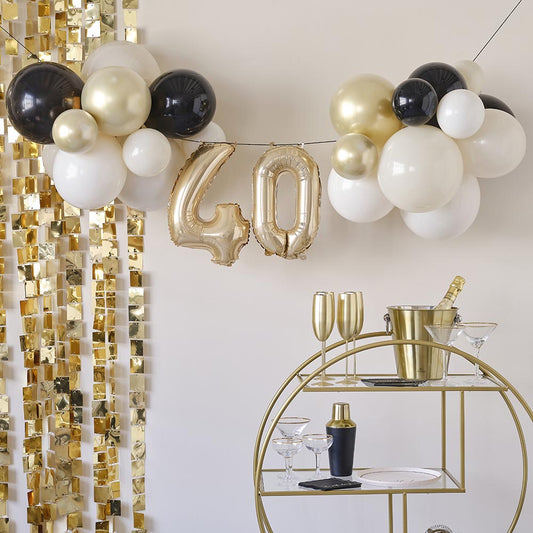 Arco a palloncino dorato e nero: decorazione per il 40° compleanno