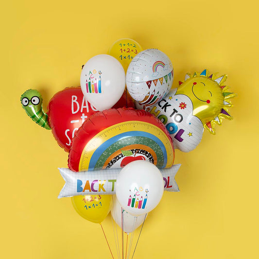 Cluster of helium-filled balloons with biodegradable latex balloons