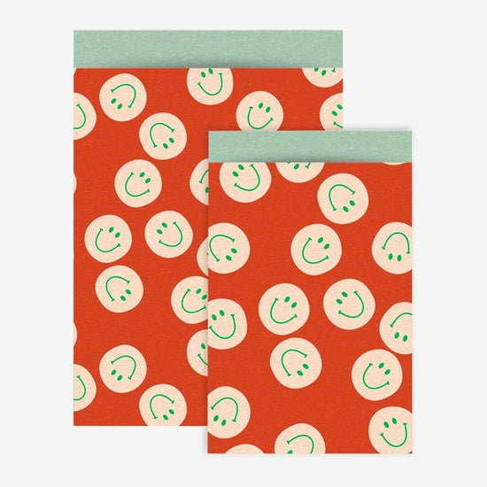 1 pochette en papier smiley corail - accessoire décoration fête annive