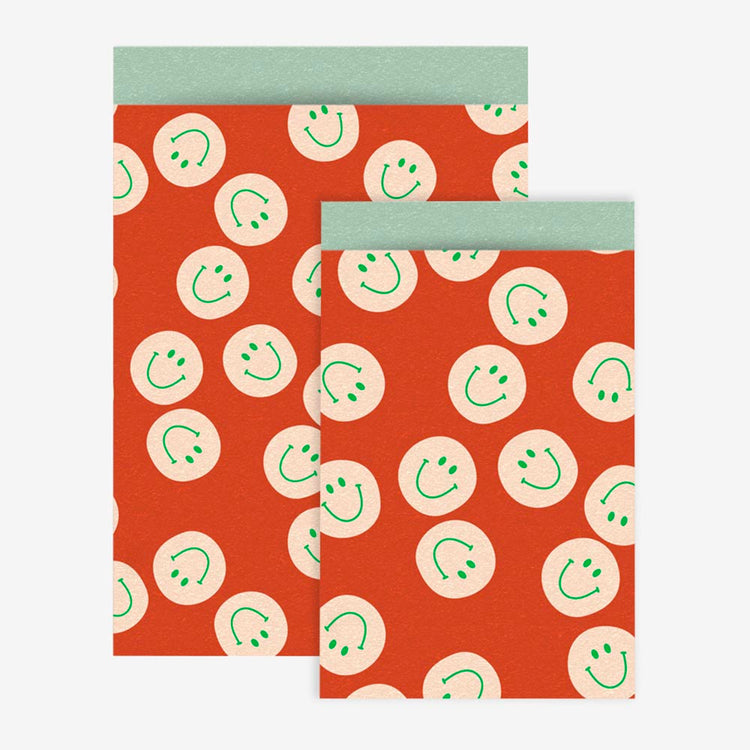 1 pochette en papier smiley corail - accessoire décoration fête annive