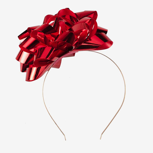 Serre tete de Noël surmonté d'un gros noeud de cadeau rouge