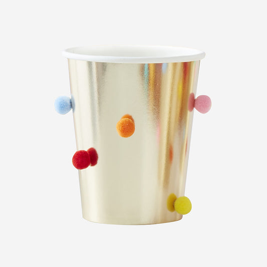 Golden cardboard cups and multicolored pompoms