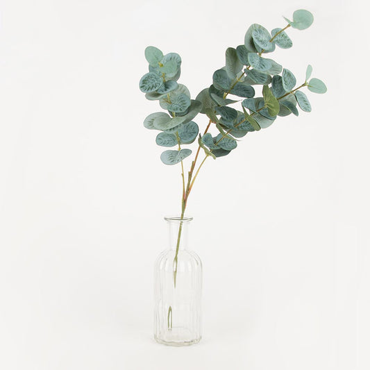 1 small glass vase with eucalyptus for a retro wedding centerpiece