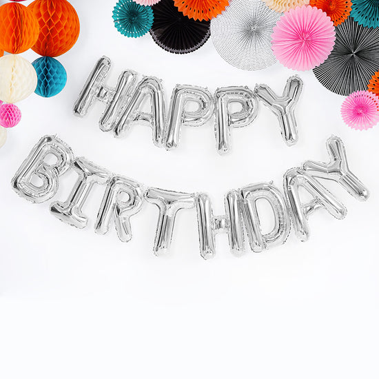 Ballons aluminium happy birthday argentés et decorations en papier