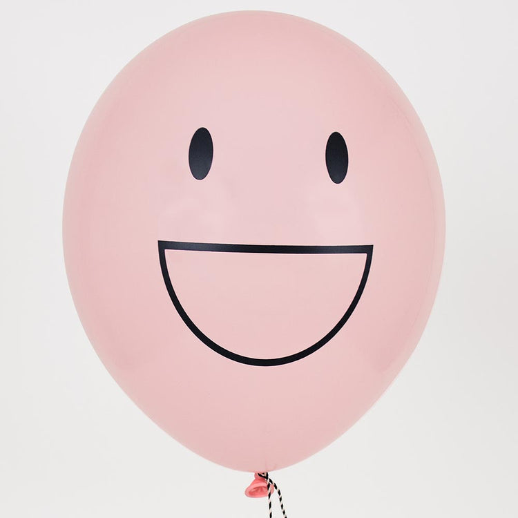 Ballons de baudruche emoji rose pour deco anniversaire enfant.