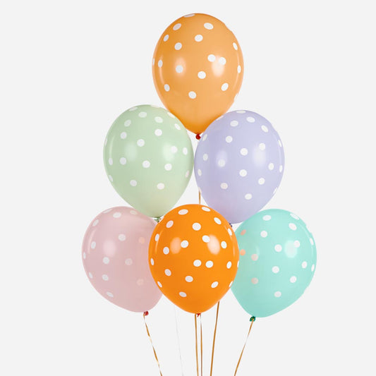 Cluster of pastel balloons with white dots for child's birthday decoration