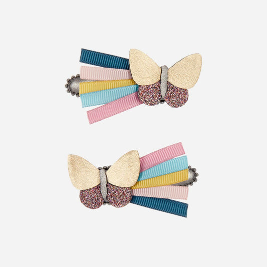 Idea de disfraz de hada de cumpleaños para niña: pasadores de mariposa en colores pastel