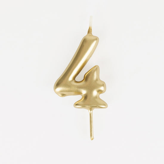 Golden number 4 birthday candle for a 4-year-old child's birthday