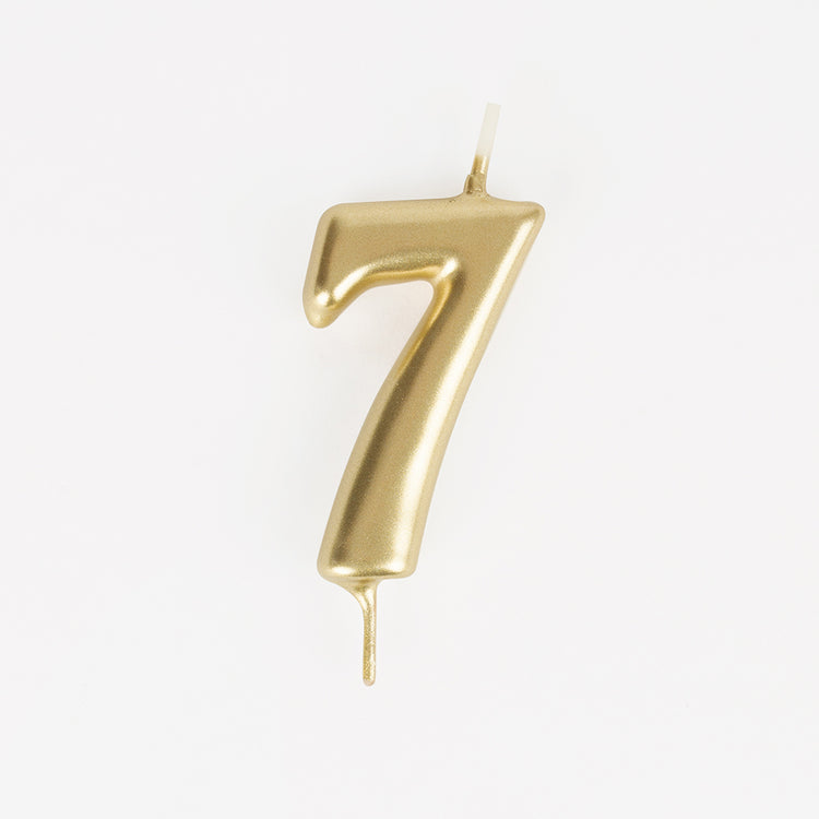 Golden number 7 birthday candle for a 7-year-old child's birthday