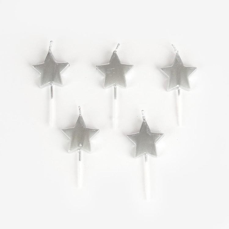 Silver star candles for space themed birthday cake decoration.