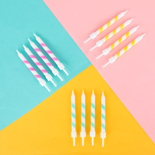 Pastel striped candles for original birthday cake decoration.