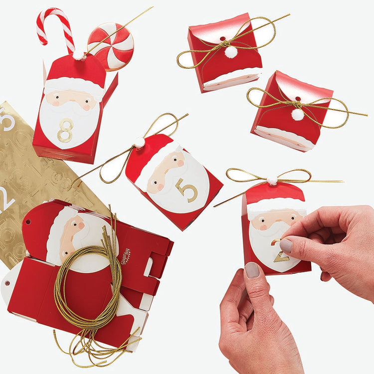 Advent calendar to fill Santa Claus boxes by ginger ray