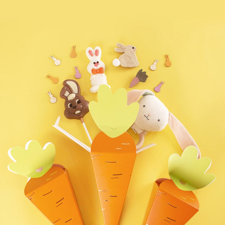 Bolsillos sorpresa de zanahoria con piruletas de chocolate para decoración de Pascua