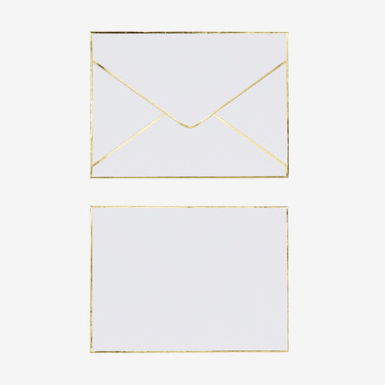 Enveloppe blanche et dorée pour glisser une carte de voeux