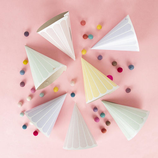 Pastel decoration for child's birthday: pointed hats and confetti