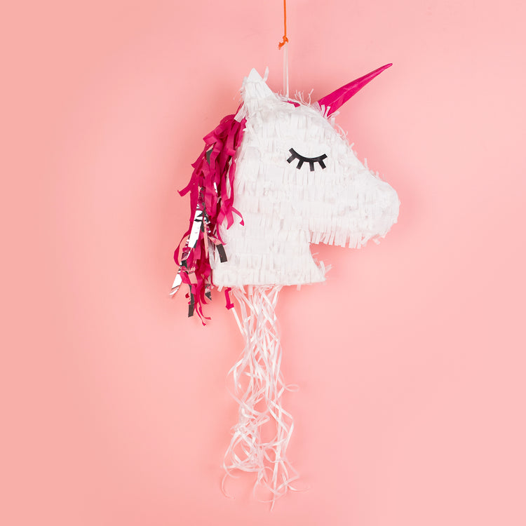 Fiesta infantil cumpleaños piñata unicornio blanco y rosa