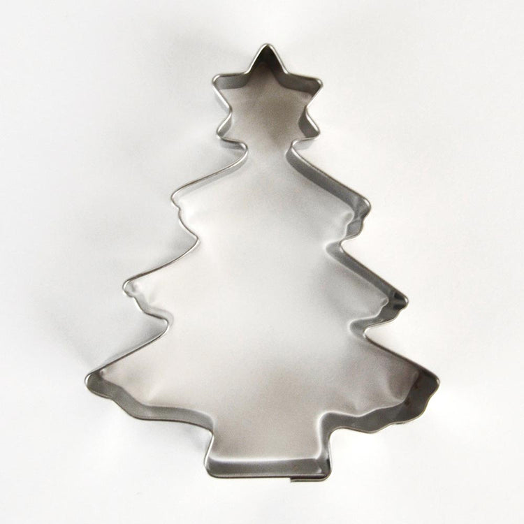 Cookie cutter in the shape of a fir tree for traditional Christmas cookies