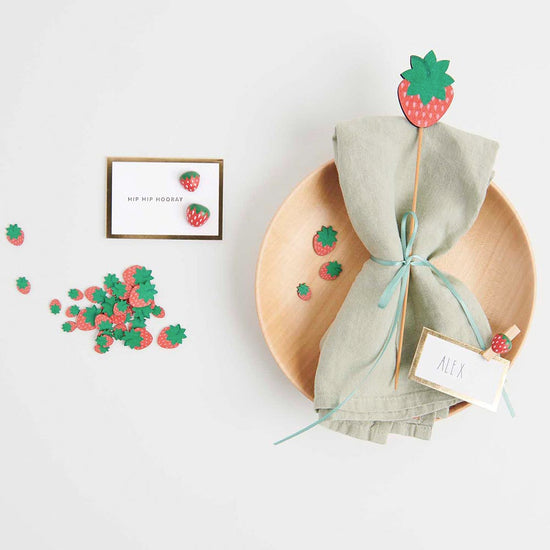 Wooden confetti for Strawberry Charlotte birthday table decoration