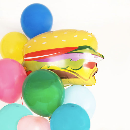 Bunch of multicolored balloons and helium burger for USA themed birthday
