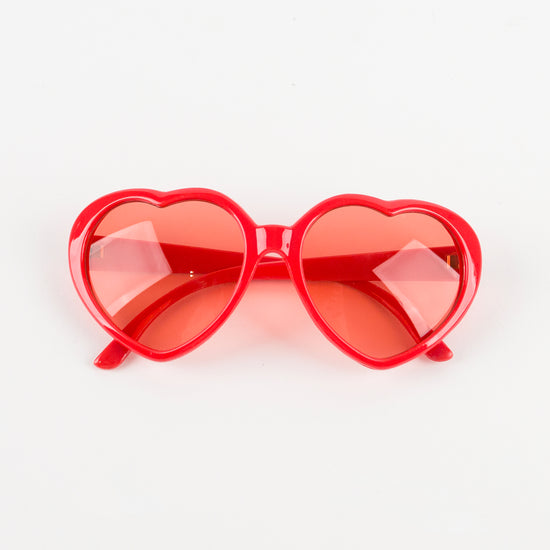 Pair of pink heart glasses with pink lenses for a love disguise