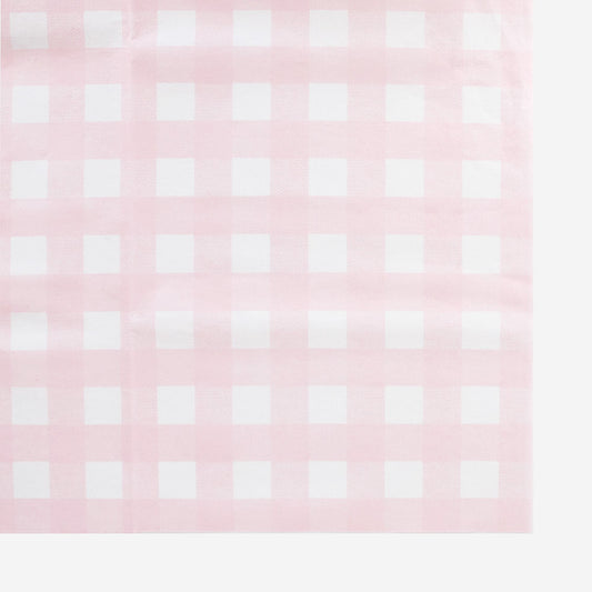 Una tovaglia di carta spessa con un motivo a quadretti rosa e bianco prodotta in Francia