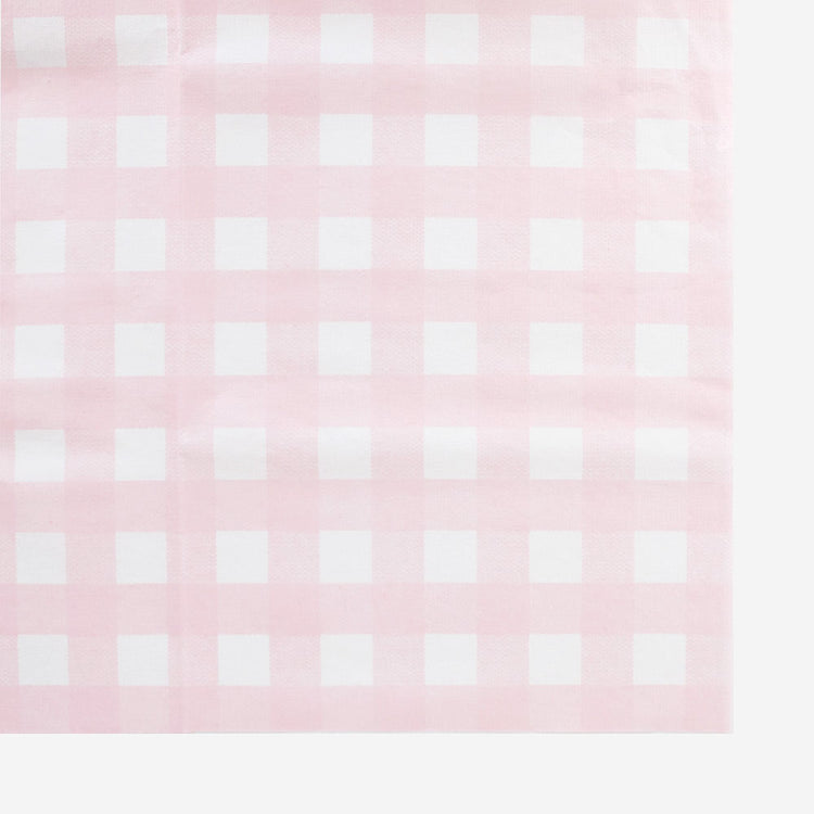 Un mantel de papel grueso con un patrón de guinga rosa y blanco hecho en Francia