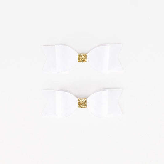 White and gold bow ties for wedding or fairy birthday decor.
