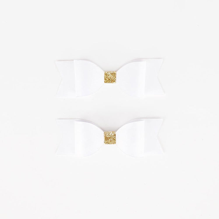 White and gold bow ties for wedding or fairy birthday decor.