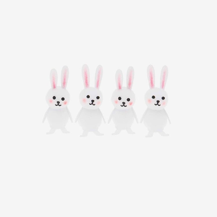 4 petits lapins blancs à mettre en decoration de table Pâques
