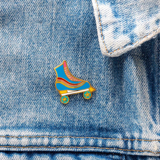 Pin's in the shape of a roller skate for a surprise birthday bag