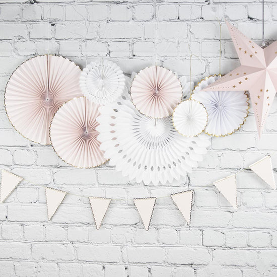 Decorations in pastel pink and white paper: baby shower decoration, girl's birthday