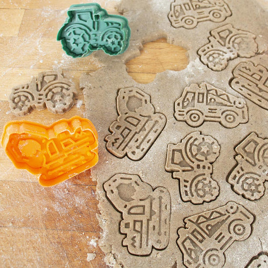1 cookie cutter in the shape of a digger for a boy's birthday cake